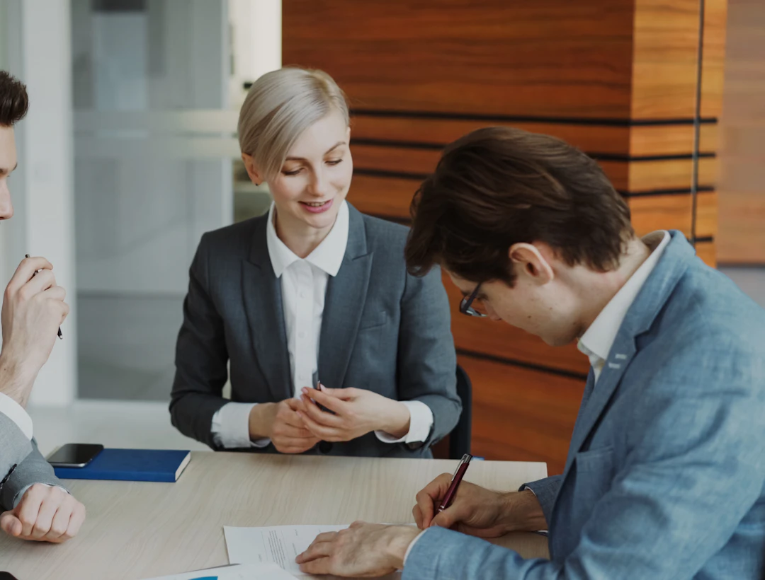 Professionals discussing documents at a table